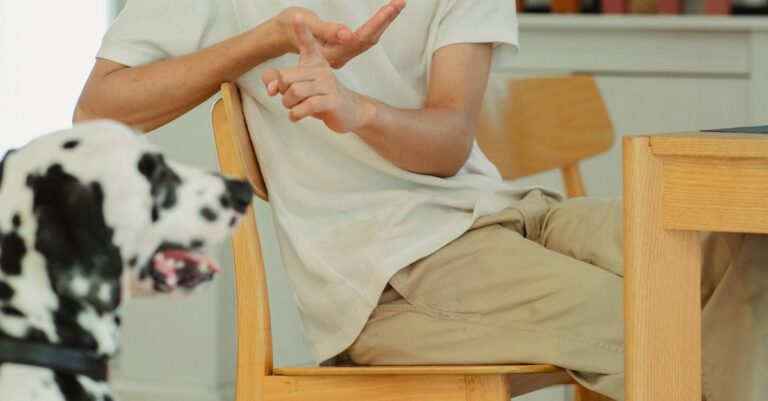 Man interacting with his Dalmatian in a cozy indoor setting. Causal and warm vibe.
